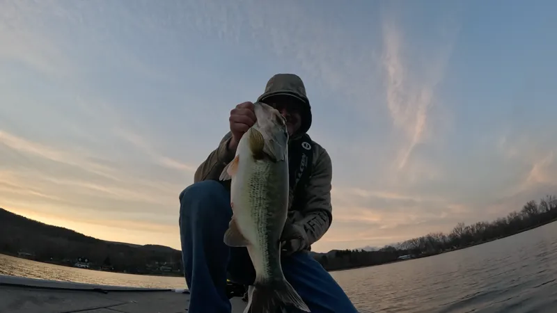 Brian holding a largemouth bass caught at Cheshire Lake